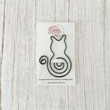 Bookmark cat design on a white card with Emini Creations branding, on a light wooden surface.