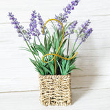 Decorative basket with lavender and greenery with a gold wire number 2 plant stake on a white wooden background